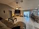 Large living room with fireplace, TV, and access to the lanai at 2210 Bayou Dr, Holiday, FL 34691