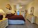 Bright main bedroom showcasing tiled floors, neutral walls, and an attractive ceiling fan at 2210 Bayou Dr, Holiday, FL 34691