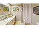 Well-lit bathroom featuring granite counter top and lots of storage at 2215 Toniwood Ln, Palm Harbor, FL 34685