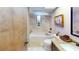 Clean bathroom features neutral colors, bath tub and shower at 2215 Toniwood Ln, Palm Harbor, FL 34685