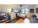 Cozy bedroom featuring natural light and a ceiling fan at 2215 Toniwood Ln, Palm Harbor, FL 34685