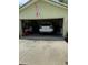 Spacious two-car garage offering ample room for parking and storage with an existing vehicle at 2215 Toniwood Ln, Palm Harbor, FL 34685