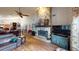 Spacious living room with stone fireplace, wood floors, and an open layout, great for entertaining or relaxing at 2215 Toniwood Ln, Palm Harbor, FL 34685