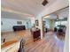 The home showcases open layout, hardwood floors, and seamlessly connected rooms, including a dining area and office at 2215 Toniwood Ln, Palm Harbor, FL 34685