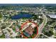 Aerial view of the property featuring the backyard screened-in pool at 22804 Willow Lakes Dr, Lutz, FL 33549