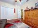 Bedroom featuring wood floors, closet and furniture with decor at 22804 Willow Lakes Dr, Lutz, FL 33549