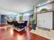 Open dining room featuring rich wood floors and lots of natural light at 22804 Willow Lakes Dr, Lutz, FL 33549