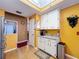 Bright kitchen features wood floors, and white cabinets with a beautiful countertop, and a skylight at 22804 Willow Lakes Dr, Lutz, FL 33549