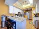Well-equipped kitchen featuring granite countertops and a breakfast bar at 22804 Willow Lakes Dr, Lutz, FL 33549