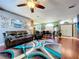 Spacious living room with stylish rug, leather furniture, and open layout at 22804 Willow Lakes Dr, Lutz, FL 33549