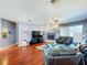 Inviting living room with a cozy fireplace and modern furnishings at 22804 Willow Lakes Dr, Lutz, FL 33549