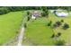 Expansive lot showcases a well-maintained home, ample space and tree coverage at 23075 Hayman Rd, Brooksville, FL 34602
