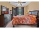 This is a bedroom with a large window and a dresser with a mirror on top of it at 23075 Hayman Rd, Brooksville, FL 34602