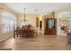 Elegant dining room featuring a chandelier, hardwood floors, and stylish furnishings at 23075 Hayman Rd, Brooksville, FL 34602