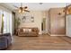 Bright living room with neutral decor, a ceiling fan, and ample natural light at 23075 Hayman Rd, Brooksville, FL 34602