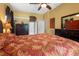 Bright main bedroom featuring ensuite bathroom, large windows, and comfortable furnishings at 23075 Hayman Rd, Brooksville, FL 34602