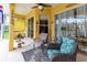 Cozy covered porch featuring comfortable seating and stylish decor at 23075 Hayman Rd, Brooksville, FL 34602
