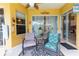 Comfortable covered porch with seating and view to the pool at 23075 Hayman Rd, Brooksville, FL 34602