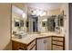 Functional bathroom with a vanity and multiple mirrors at 2333 Feather Sound Drive # A409, Clearwater, FL 33762
