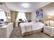 Bright bedroom with a desk by the window and a comfortable bed at 2333 Feather Sound Drive # A409, Clearwater, FL 33762