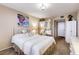 Comfortable bedroom with decorative wall art, closet, and bedside table at 2333 Feather Sound Drive # A409, Clearwater, FL 33762