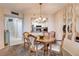 Cozy dining area with a wooden table and chairs, and kitchen view at 2333 Feather Sound Drive # A409, Clearwater, FL 33762