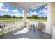 Balcony featuring outdoor seating with views of a manicured lawn at 2430 Florentine Way # 40, Clearwater, FL 33763