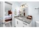 Bathroom featuring a white vanity with granite counters and a view to the bedroom at 2430 Florentine Way # 40, Clearwater, FL 33763
