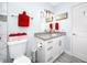 Bathroom with granite vanity, bright lighting, and neutral paint at 2430 Florentine Way # 40, Clearwater, FL 33763