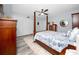 Well-lit bedroom with a four-poster bed, light blue walls, and neutral carpet that adds warmth and style at 2430 Florentine Way # 40, Clearwater, FL 33763