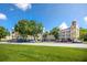 Spacious condo building with manicured lawn, ample parking, and classic architectural details at 2430 Florentine Way # 40, Clearwater, FL 33763
