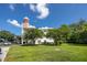 Back of condo showing tower design, mature landscaping and convenient parking at 2430 Florentine Way # 40, Clearwater, FL 33763