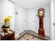 Entry hall with grandfather clock and neutral colors at 2430 Florentine Way # 40, Clearwater, FL 33763