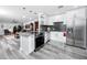 Modern kitchen featuring white cabinets, stainless steel appliances, and an open layout at 2430 Florentine Way # 40, Clearwater, FL 33763
