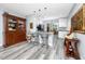 Charming kitchen with gray granite countertops, breakfast bar, and adjacent dining area at 2430 Florentine Way # 40, Clearwater, FL 33763