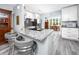 Modern kitchen with granite countertops, white cabinets, stainless steel appliances, and eat in breakfast nook at 2430 Florentine Way # 40, Clearwater, FL 33763