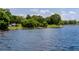 Scenic lake view with lush green surroundings offers a peaceful and picturesque waterfront setting at 2430 Florentine Way # 40, Clearwater, FL 33763