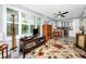 Cozy living room showcasing plantation shutters, modern ceiling fan, and stylish furnishings at 2430 Florentine Way # 40, Clearwater, FL 33763
