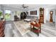 Bright living room featuring a comfortable gray sofa, decorative rug, and unique Asian-inspired decor at 2430 Florentine Way # 40, Clearwater, FL 33763