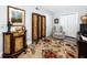 Well-decorated sitting room with nice area rug and furnishings, showing the closet and bedroom door at 2430 Florentine Way # 40, Clearwater, FL 33763