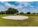 Sand trap on a golf course with lush green grass and manicured landscaping within a community at 2430 Florentine Way # 40, Clearwater, FL 33763