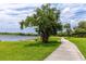 Tranquil walking path alongside a scenic lake, providing a peaceful environment for exercise and relaxation at 2430 Florentine Way # 40, Clearwater, FL 33763