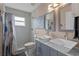 Bathroom with double vanity, square sinks, and a shower with sliding glass doors at 2511 Groveway Dr, Valrico, FL 33596