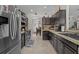Updated kitchen features sleek stainless appliances, dark cabinets, and stone countertops at 2511 Groveway Dr, Valrico, FL 33596
