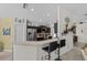 Modern kitchen features bar seating, sleek appliances, and easy access to dining area at 2511 Groveway Dr, Valrico, FL 33596