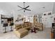 Open-concept living space with tile floors, a large sectional sofa, and seamless flow to the kitchen and dining areas at 2511 Groveway Dr, Valrico, FL 33596
