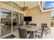 Enjoy outdoor living on this covered patio with ceiling fan and entertainment area at 2511 Groveway Dr, Valrico, FL 33596