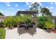 Private patio area with comfortable seating, perfect for outdoor entertaining at 2511 Groveway Dr, Valrico, FL 33596