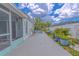 Beautiful backyard with tropical foliage, lush plants, and serene pool area, perfect for relaxation and enjoyment at 2533 Blossom Lake Dr, Holiday, FL 34691