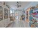 Charming bedroom featuring whimsical decor, comfortable seating, and bright accents creating a playful atmosphere at 2533 Blossom Lake Dr, Holiday, FL 34691